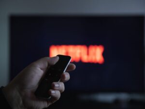 A person switching on Netflix, a high-Agency culture company